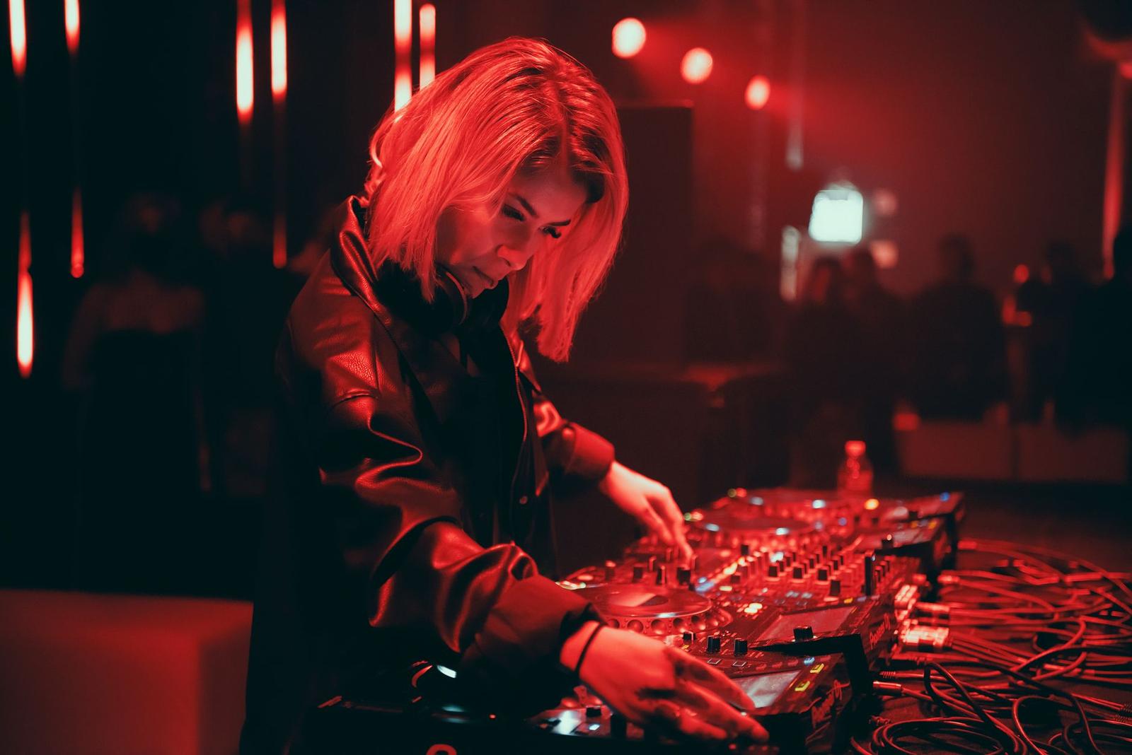 Female Dj Using a Dj Mixer